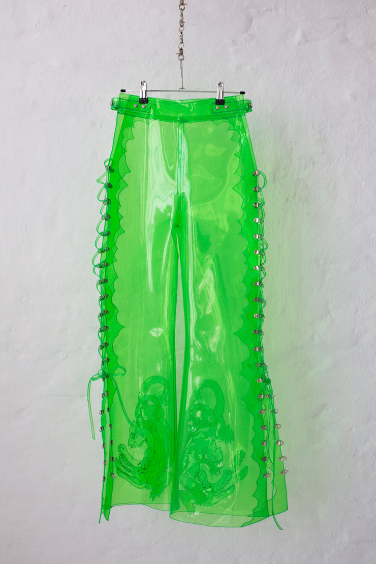 Green glitter PVC pants flared cut, laceable on the side with crocodile embroidery at the hem