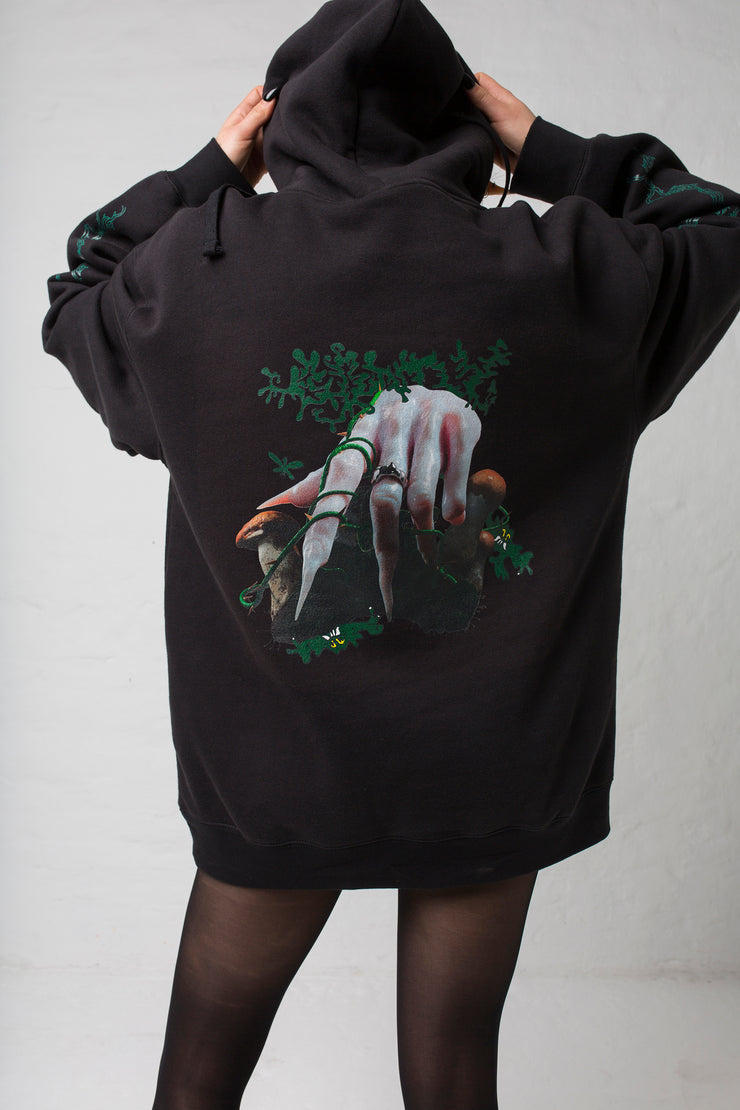 fashion brand BONDY photoshoot showcasing handmade HARLEY black cotton oversized hoodie with digital print on front and back shown on a size small model, part of the new collection DREY:MA. back view