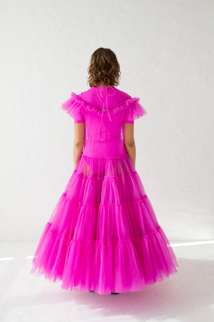 A tulle dress in fuchsia wit  layered ruffles, short sleeve and round neckline