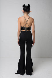 fashion brand BONDY showcasing handmade SERAPHINA  black high waisted side slit flare pants/trousers shown on a size small model, part of the new DREY:MA collection. full body side view