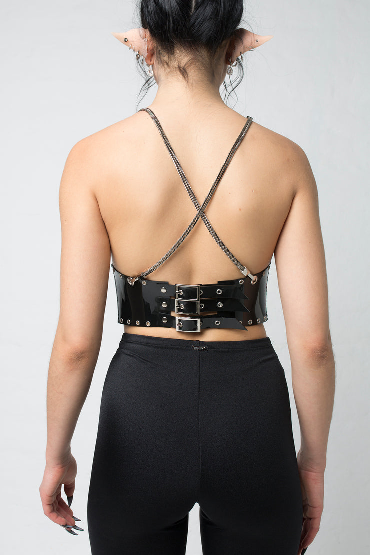 fashion brand BONDY photoshoot showcasing handmade COSIMA black PVC corset with chain detail shown on size small model, part of new collection DREY:MA. back view