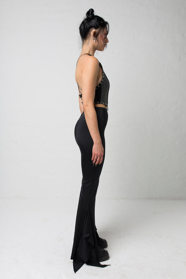fashion brand BONDY showcasing handmade SERAPHINA  black high waisted side slit flare pants/trousers shown on a size small model, part of the new DREY:MA collection. full body side view
