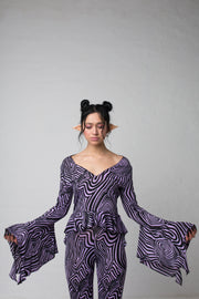 fashion brand BONDY photoshoot showcasing handmade AURORA abstract long-sleeve purple and black flare top on size small model, part of new collection DREY:MA. front view