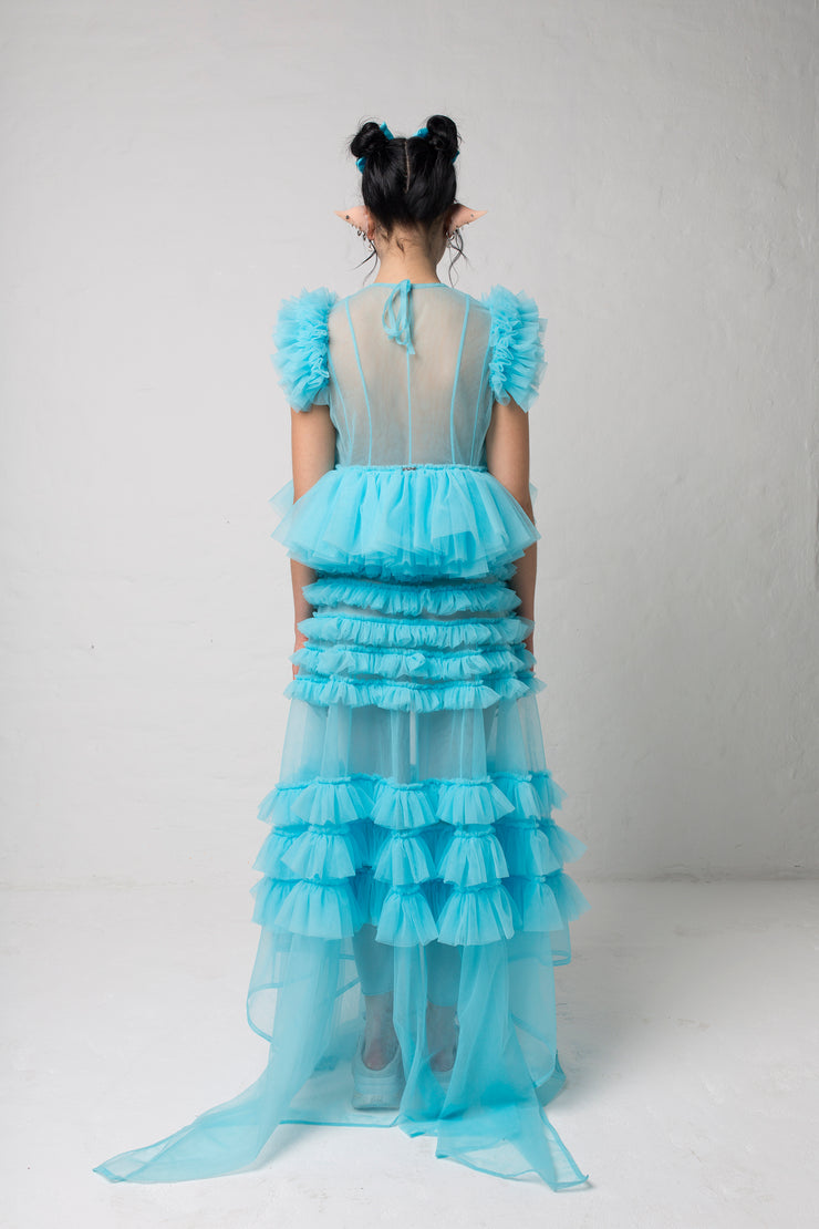 fashion brand BONDY photoshoot showcasing handmade FLEUR ice blue cropped, sheer ruffle 100% tulle top shown on a size small, part of the new collection DREY:MA. full body back view