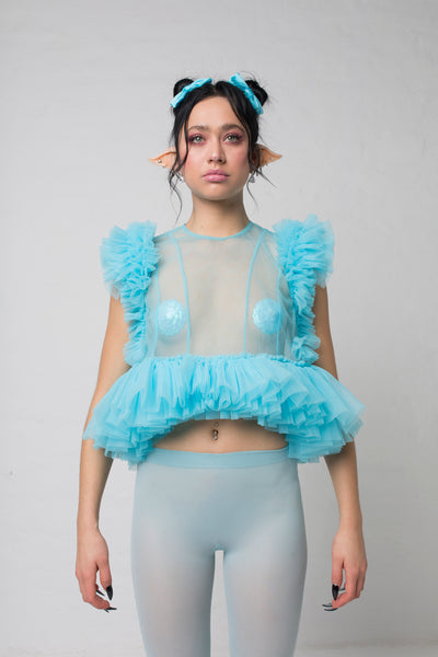 fashion brand BONDY photoshoot showcasing handmade FLEUR ice blue cropped, sheer ruffle 100% tulle top shown on a size small, part of the new collection DREY:MA. front view