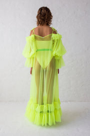 Flue yellow floor length evening gown with voluminous off-shoulder puffy sleeves and thin shoulder straps. Contrasted by sheer body and ruffled hem