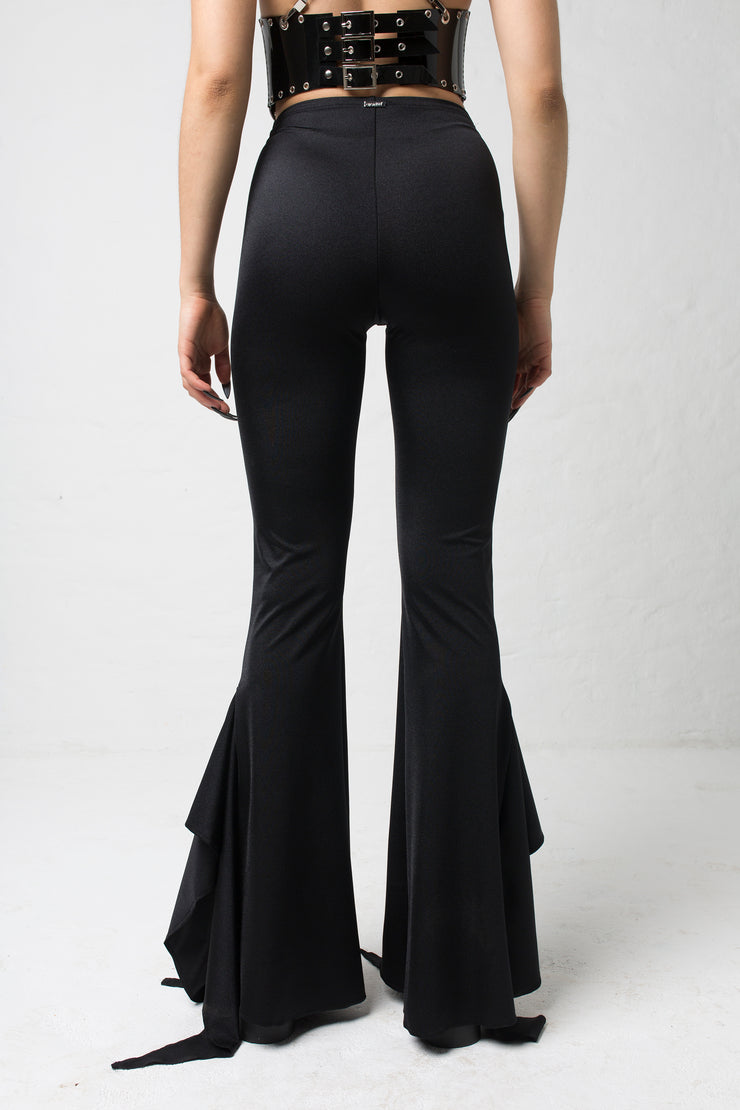 fashion brand BONDY showcasing handmade SERAPHINA  black high waisted side slit flare pants/trousers shown on a size small model, part of the new DREY:MA collection. back view