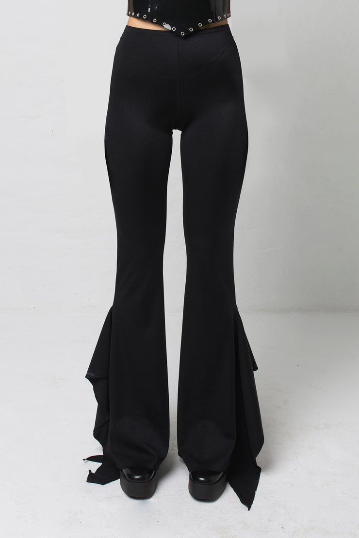 fashion brand BONDY showcasing handmade SERAPHINA  black high waisted side slit flare pants/trousers shown on a size small model, part of the new DREY:MA collection. front view
