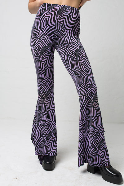 fashion brand BONDY showcasing handmade SERAPHINA purple and black abstract high waisted side slit flare pants/trousers shown on a size small model, part of the new DREY:MA collection. front view