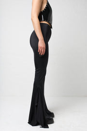 fashion brand BONDY showcasing handmade SERAPHINA  black high waisted side slit flare pants/trousers shown on a size small model, part of the new DREY:MA collection. side view
