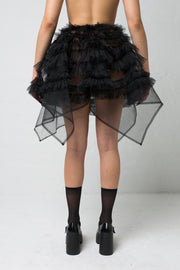 fashion brand BONDY showcasing handmade NERA high waisted double layered black tulle mini skirt with ruffle detail shown on size small model, part of the new collection DREY:MA. back view