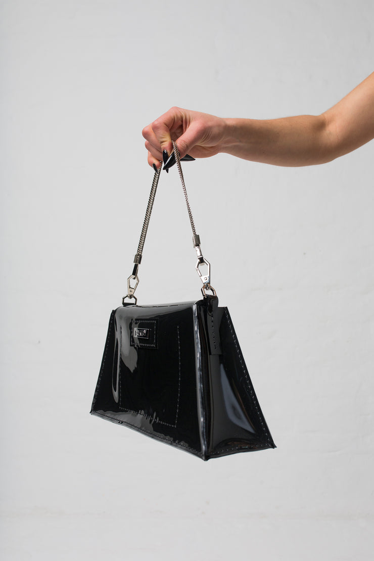 fashion brand BONDY showcasing handmade XENIA black 100% PVC bag with chain shoulder strap, part of the new collection DREY:MA. side view
