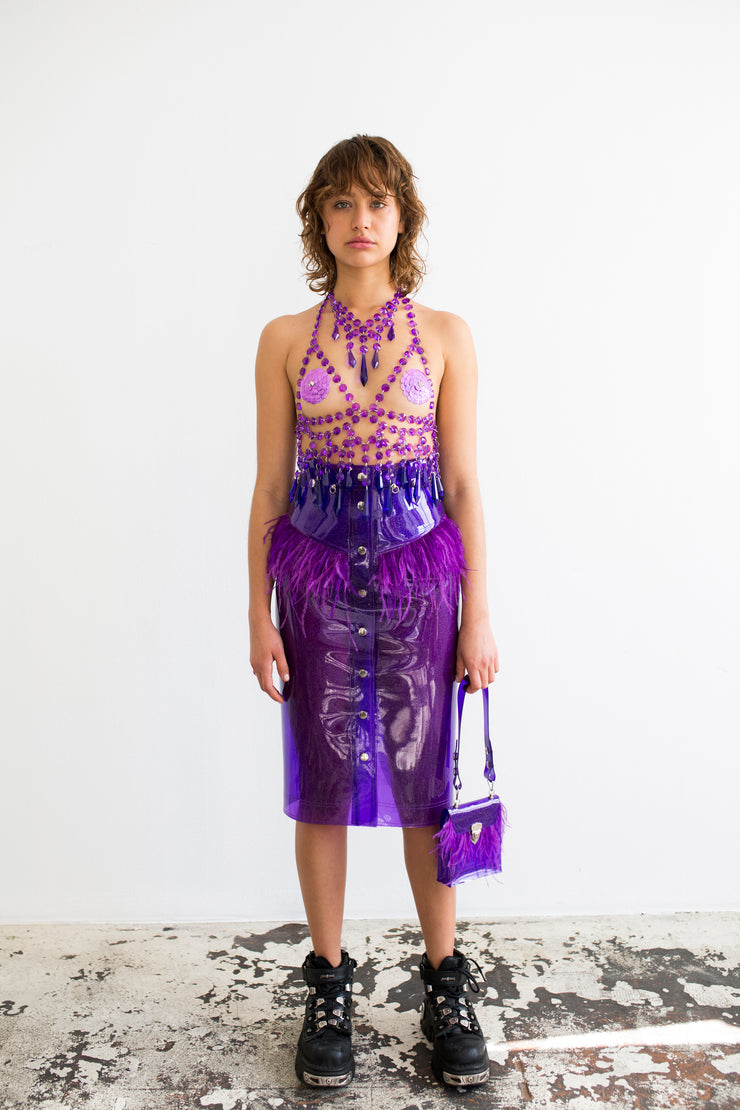 Purple glitter pencil skirt in PVC with ostrich feathers at hem with decorative belt loop