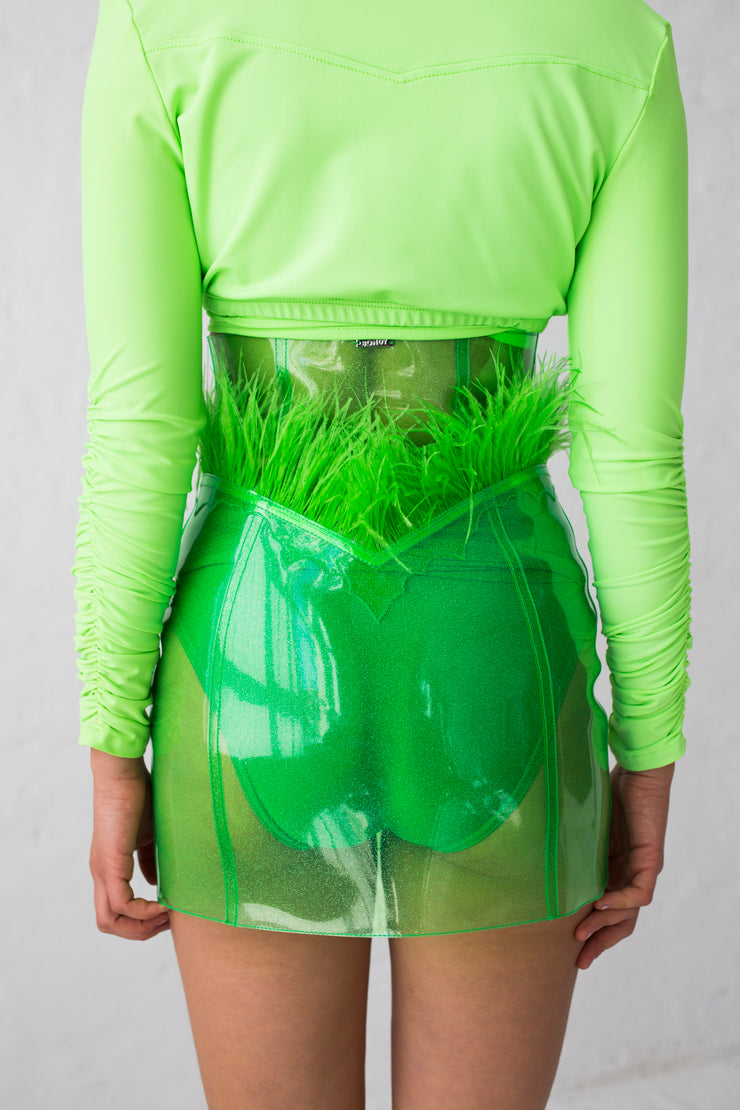 High cut green glitter PVC mini skirt with feather details and flame embroidery