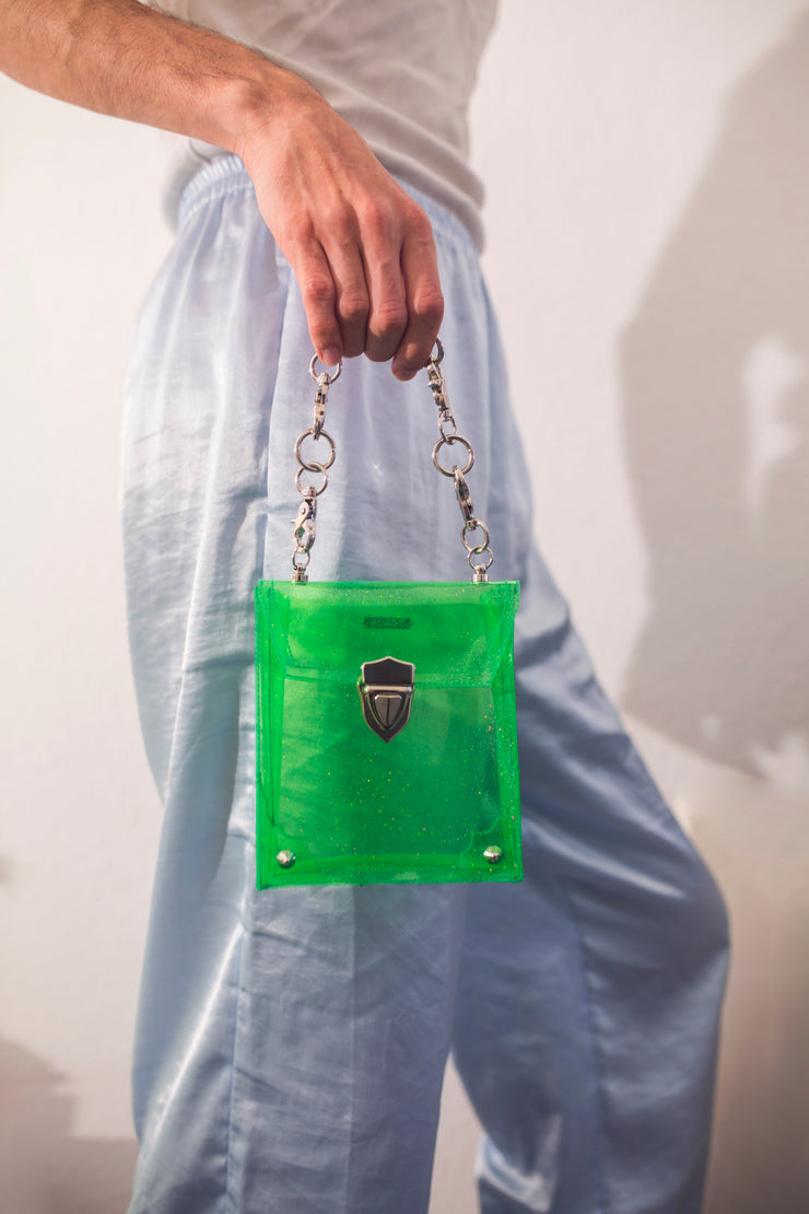 Green glitter PVC bag with heavy hardware and frame embroidery