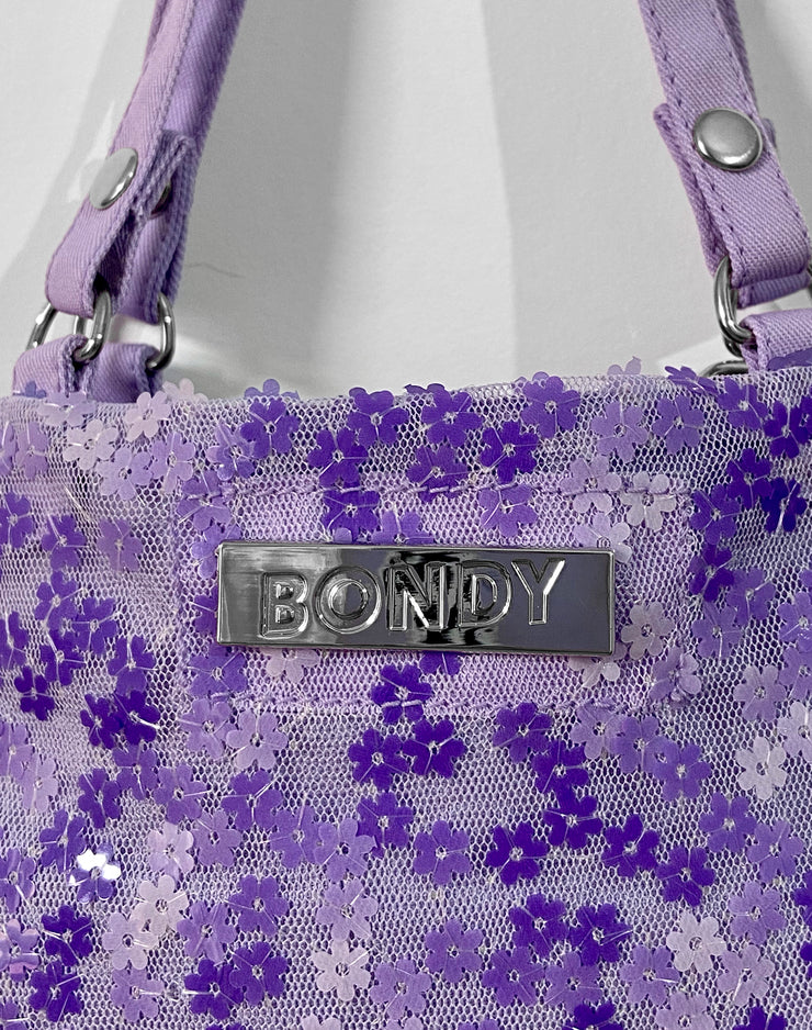 fashion brand BONDY showcasing handmade POLLY lilac embodied mesh mini tote bag with chain detail and magnetic closure, part of the Sussex Dreams collection
